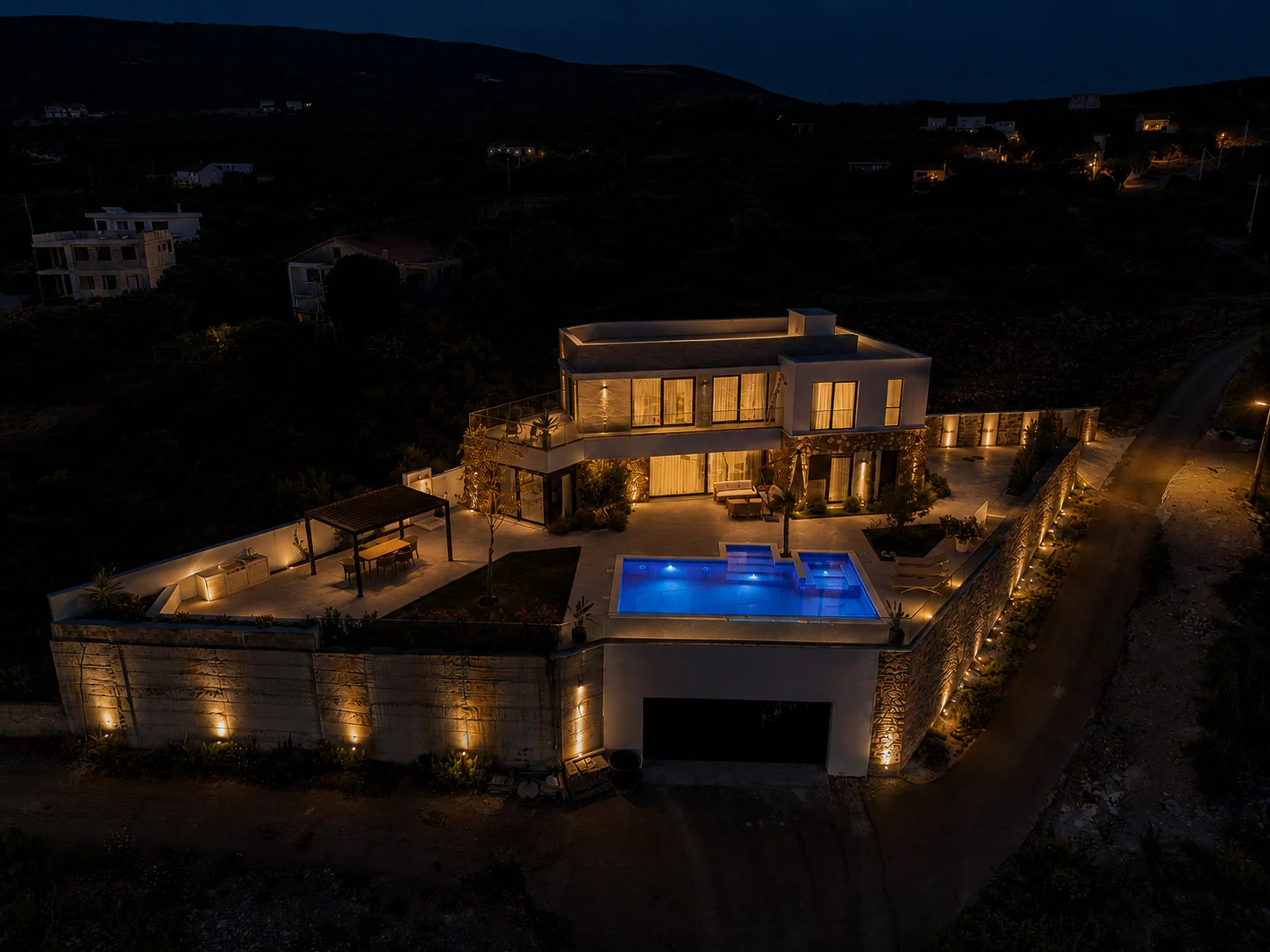 Villa Aventura illuminated at night